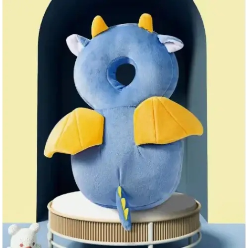 Blue plush dragon-shaped neck pillow with yellow horns, wings, and tail accents.