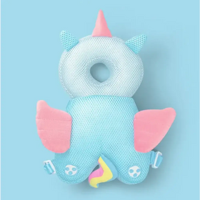 A soft, mesh unicorn-shaped baby head support with pink horns and wings, light blue body, and colorful rainbow tail.