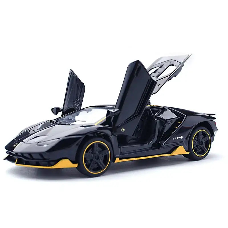 Black and yellow lamborghini model car with scissor doors open.