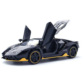 Black and yellow lamborghini model car with scissor doors open.