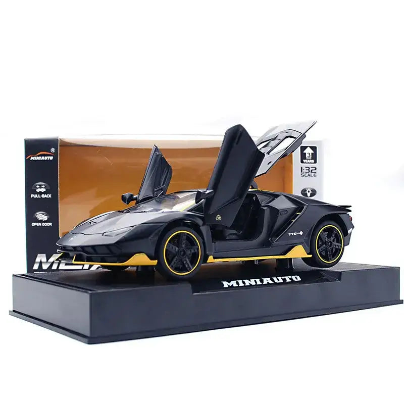 Black and yellow diecast lamborghini model car with scissor doors open, displayed on a branded base.