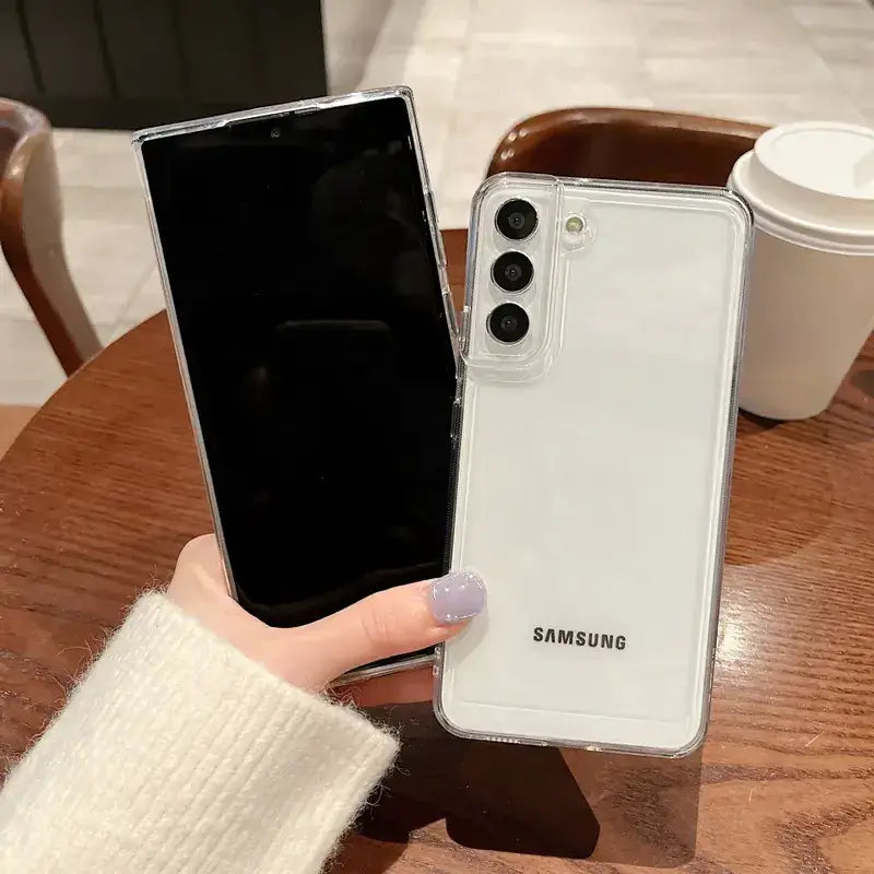 Clear protective case for a samsung galaxy s22 smartphone, featuring a transparent design that reveals the white back panel and camera module.