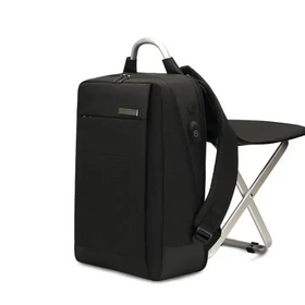 Black nylon backpack with silver-toned handle and charging port.