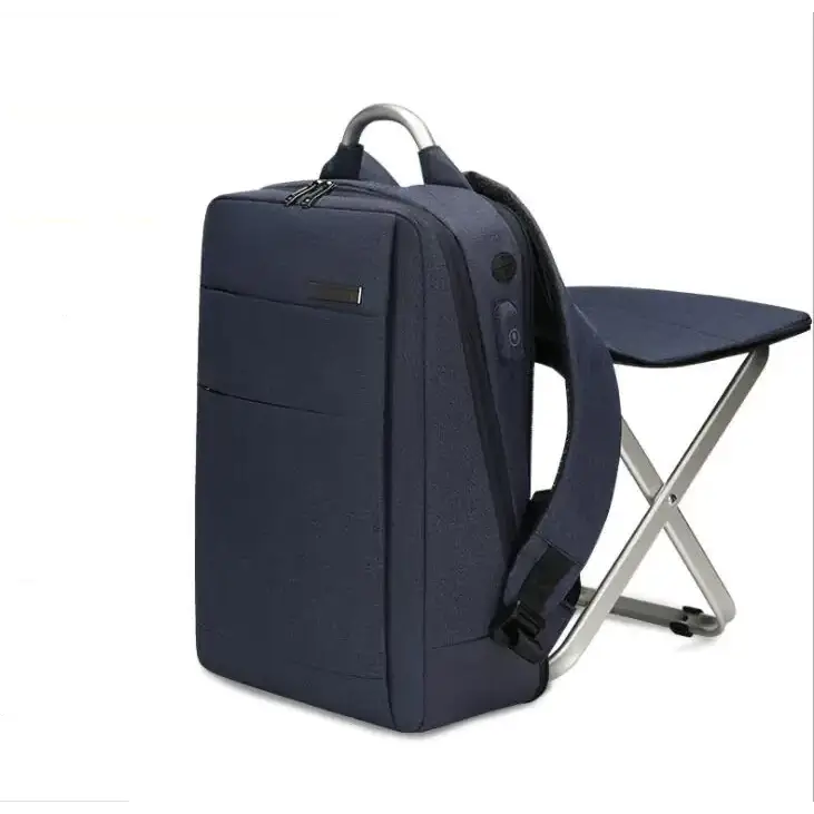 Navy blue textured fabric backpack with silver metal handle and side pocket featuring a power bank port