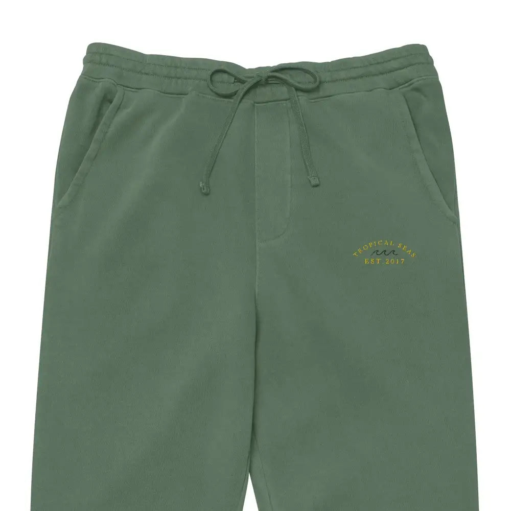 Olive green sweatpants with a drawstring waistband and embroidered logo on the left thigh.