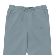 Light blue sweatpants with a drawstring waistband and subtle embroidered logo on the thigh.