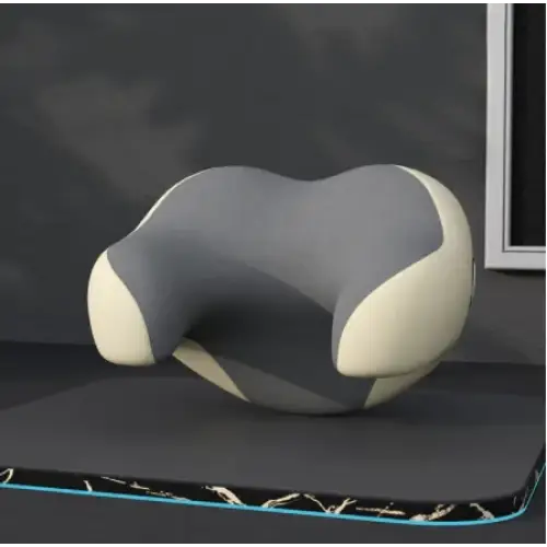 Gray and cream-colored ergonomic neck pillow with a contoured, supportive design.