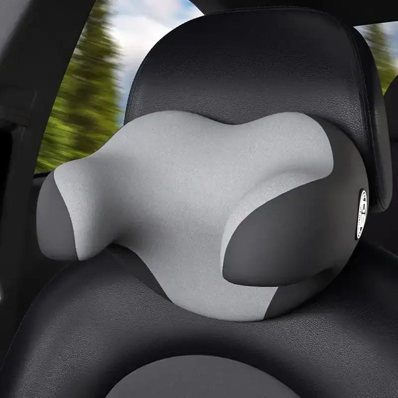 Gray and black ergonomic car headrest pillow with contoured design for neck support.