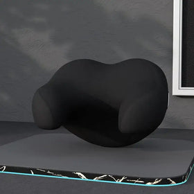 Black ergonomic neck pillow with contoured shape and soft fabric surface