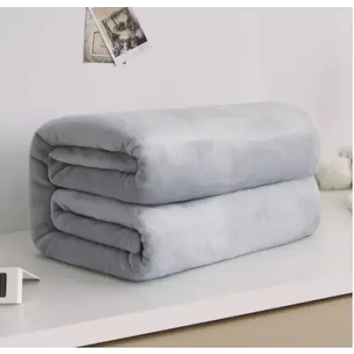A soft, light gray plush blanket neatly folded into a compact stack.