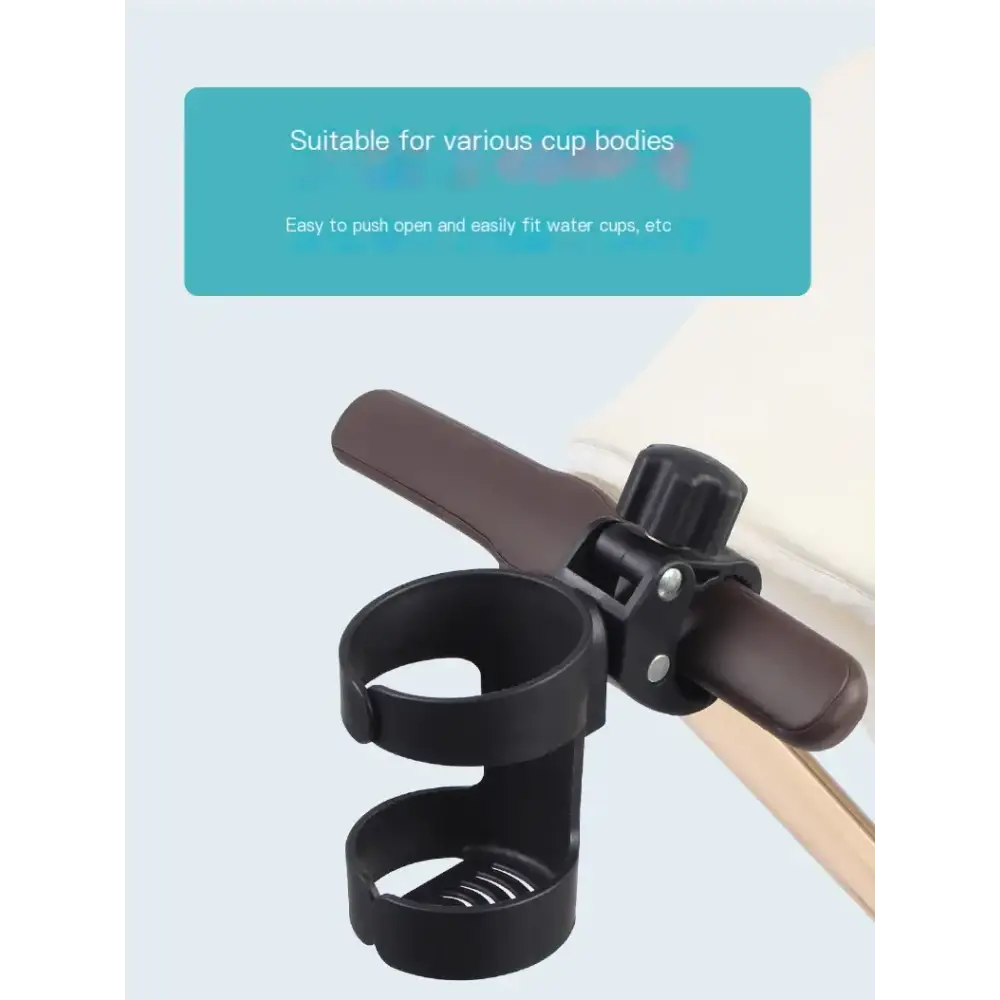 Black plastic cup holder with brown handle attachment, designed to clip onto stroller handles.