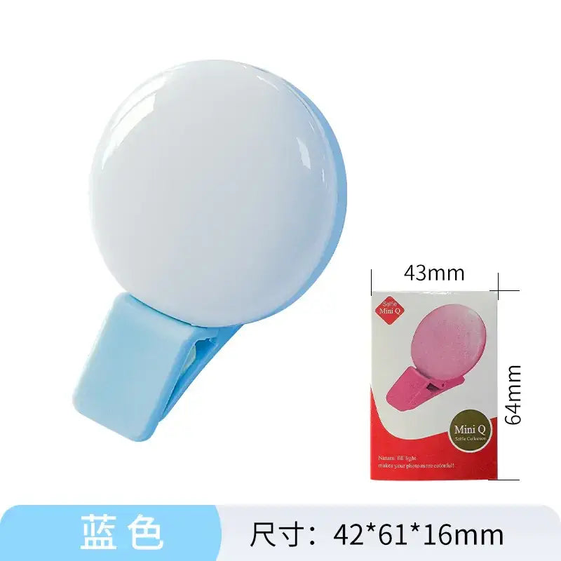 Light blue circular selfie clip-on ring light with a glossy finish and a matching clip.