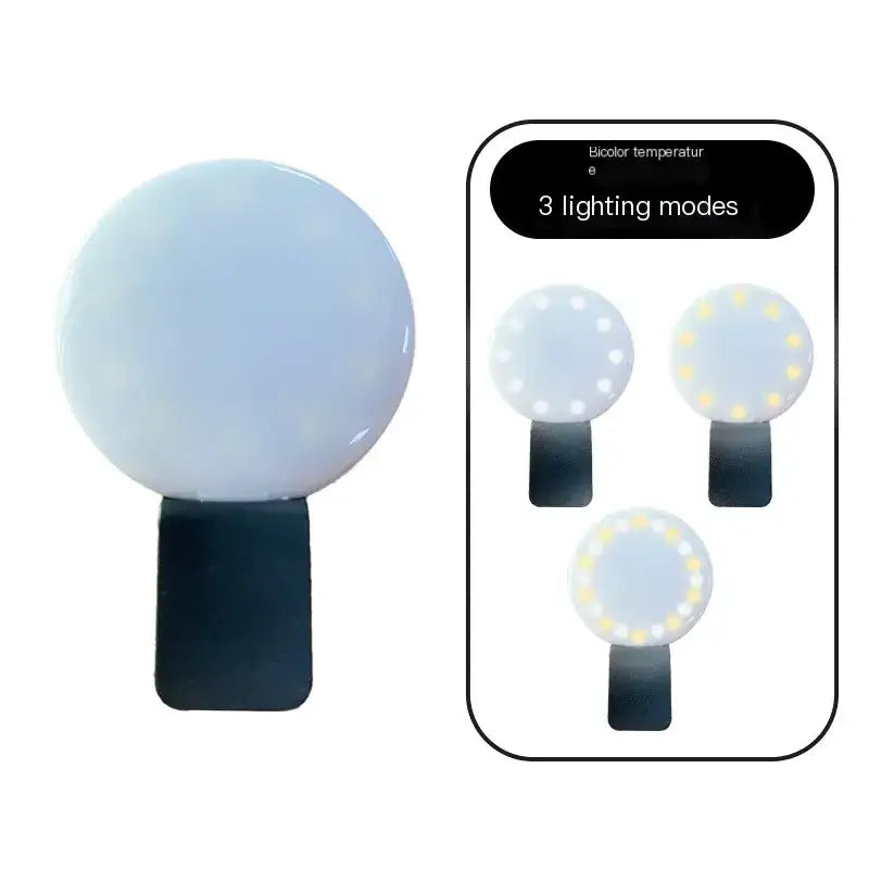 A sleek, spherical white led light with a black clip base and three lighting modes for adjustable color temperature.