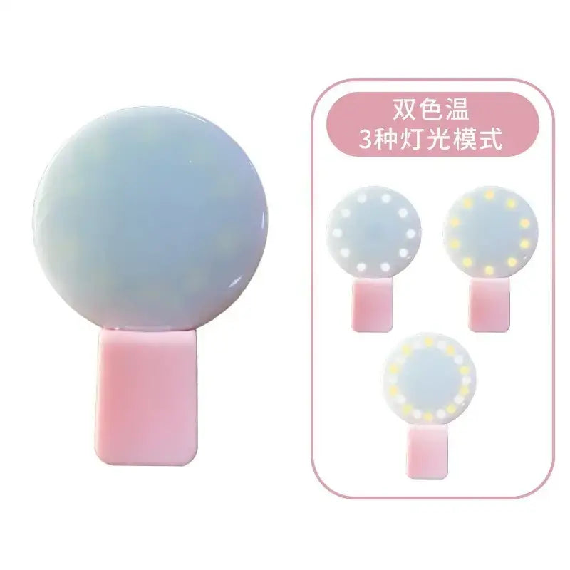 A soft pastel blue spherical led light with a pink rectangular base, featuring three lighting modes and dual-color temperature settings.