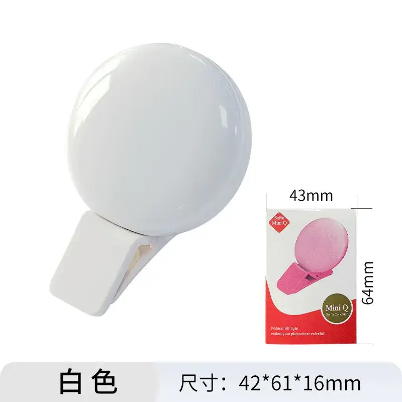 White spherical selfie light with a clip-on base.