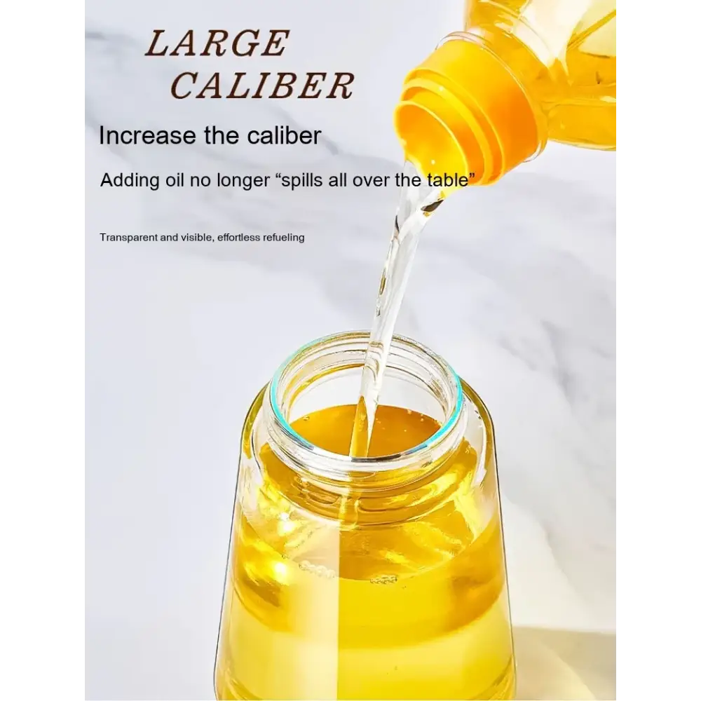 A transparent glass jar with a wide mouth, filled with golden-yellow cooking oil.