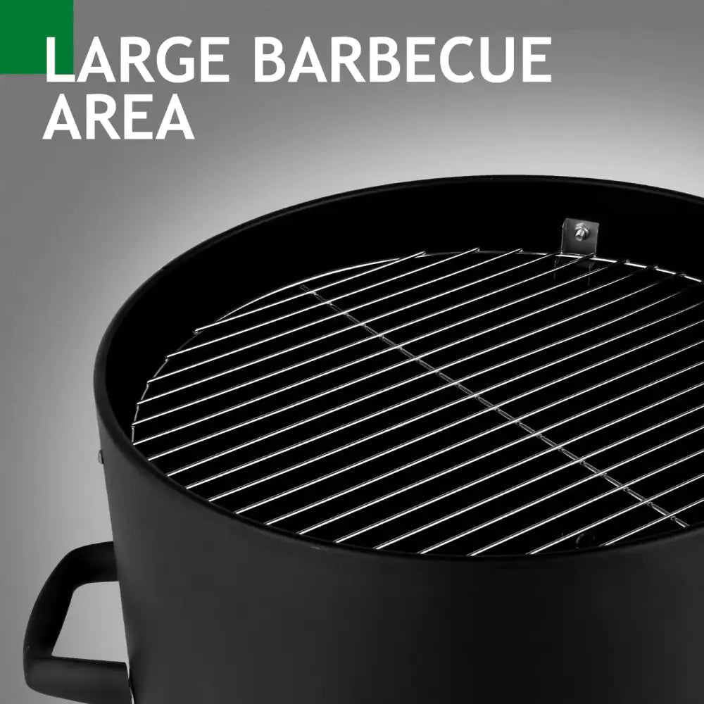 Black cylindrical barbecue grill with a shiny stainless steel grilling rack.