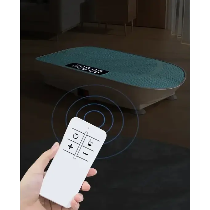Teal textured surface with a digital display on top of an elliptical vibration fitness platform, controlled by a white remote.