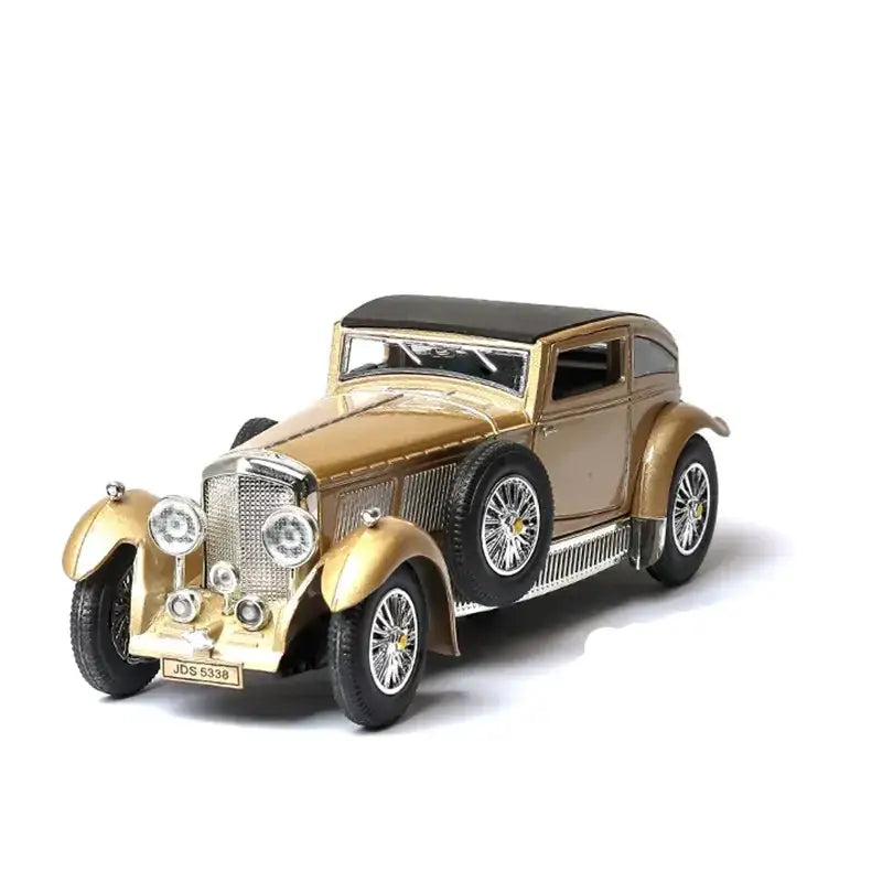 Golden vintage car model with black roof and chrome accents.