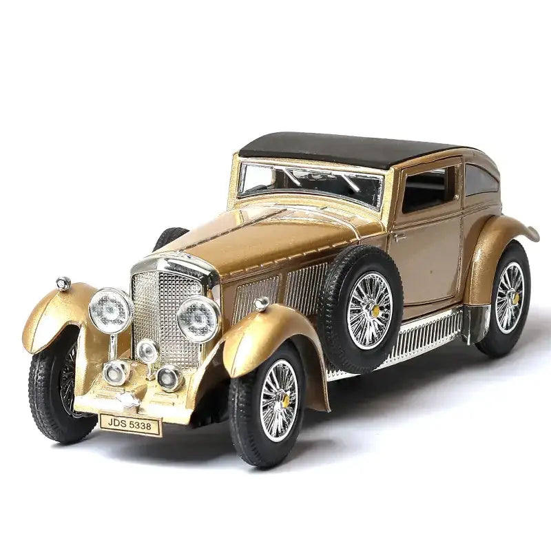 Golden vintage car model with black roof and chrome accents.