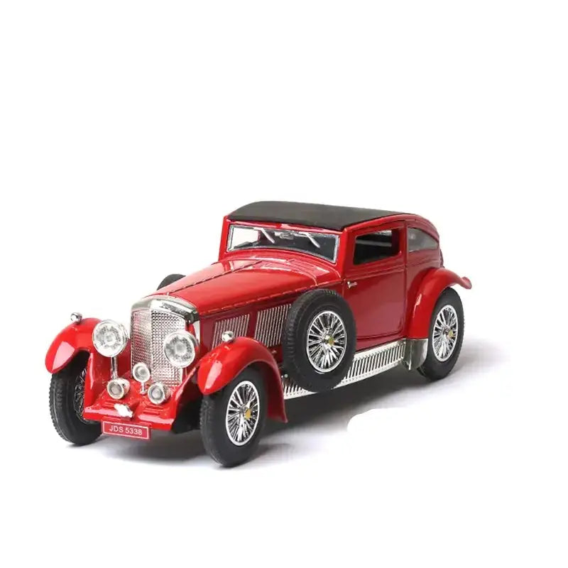 Red vintage-style diecast model car with a black convertible top and chrome detailing.