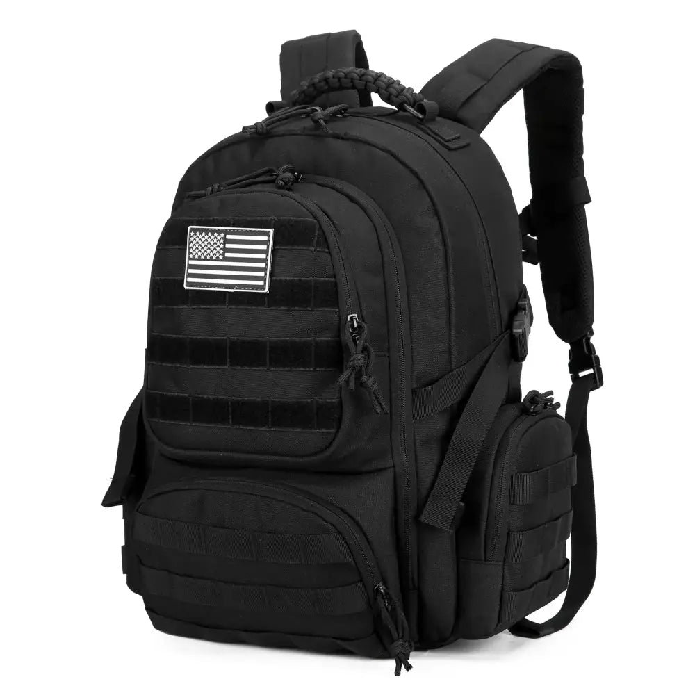 Black tactical backpack with a white american flag patch and multiple zippered compartments.