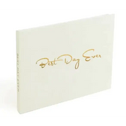 Cream-colored hardcover journal with elegant gold foil lettering that reads ’best day ever’ in a cursive script.