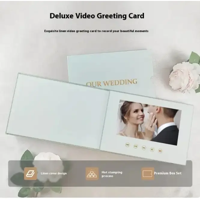 Deluxe video greeting card with a linen cover and gold hot-stamped ’our wedding’ text, featuring an embedded screen displaying a couple’s image.