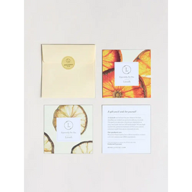 Cream-colored envelope with a gold circular seal bearing the lush logo.