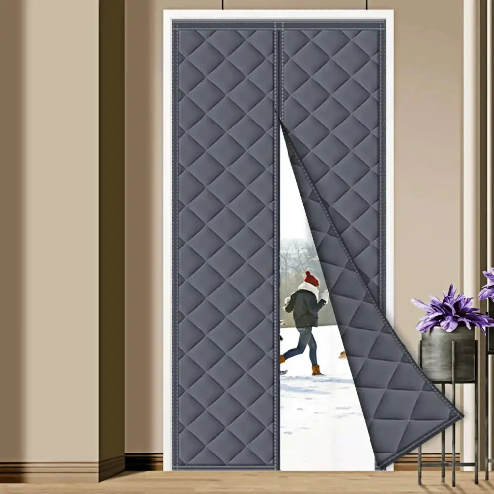 Dark gray quilted magnetic door curtain with diamond-stitched pattern and visible stitching along the edges.