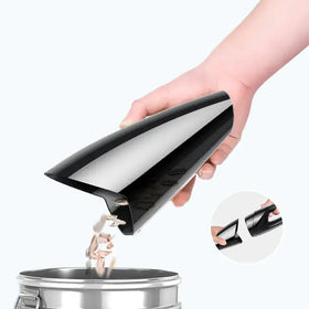 Black, glossy plastic car vacuum attachment with a sleek conical design.