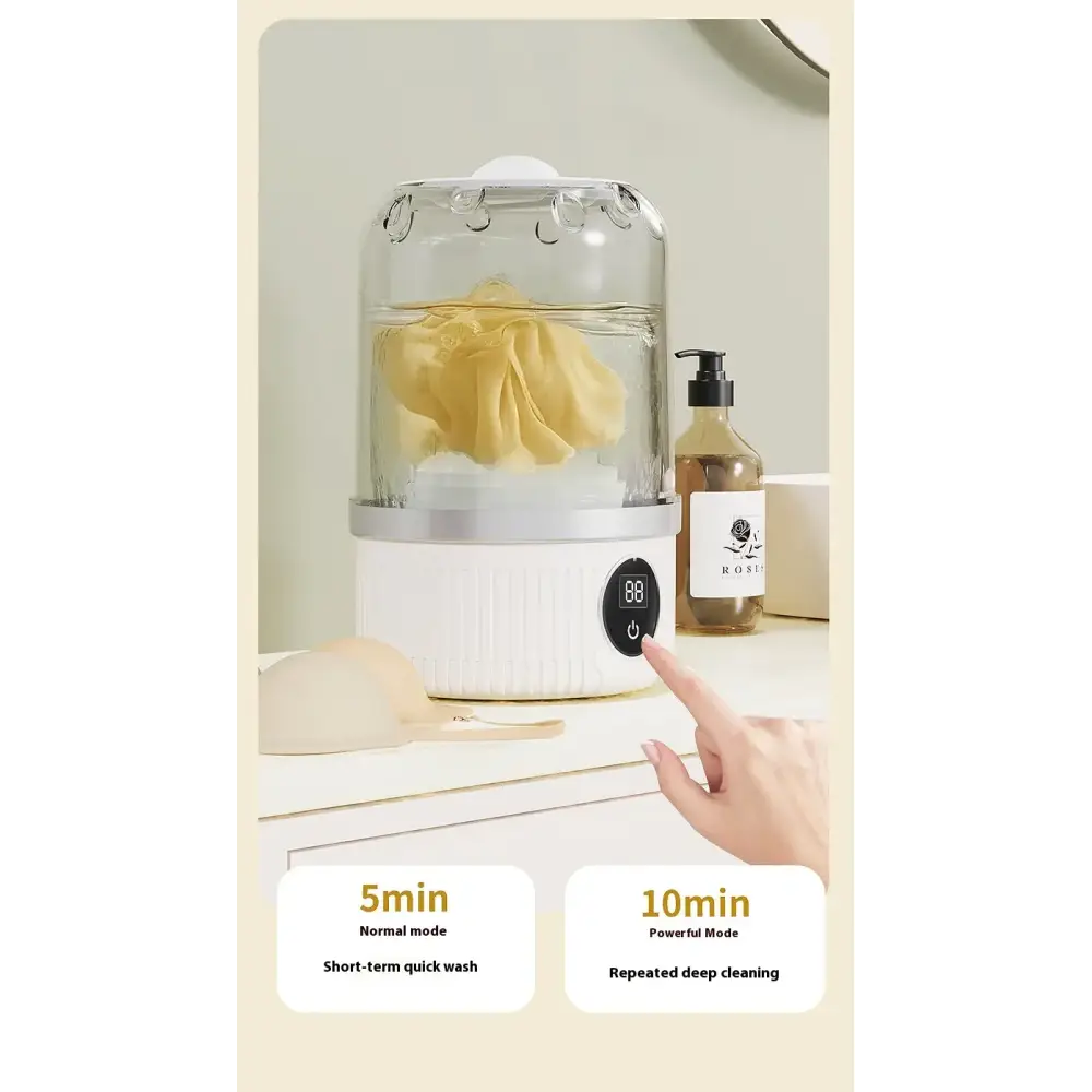 White electric garment steamer with a clear glass dome and silver accents, featuring a digital control panel for 5-minute normal mode or 10-minute powerful deep cleaning.