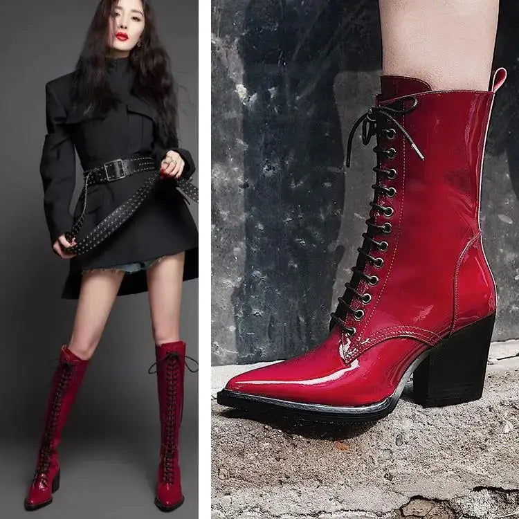 Vibrant red patent leather lace-up ankle boot with a black block heel and silver eyelets.
