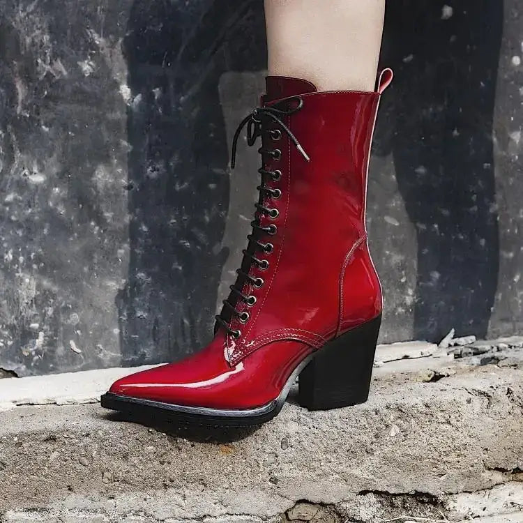 Vibrant red patent leather lace-up ankle boot with a black block heel and pointed toe.