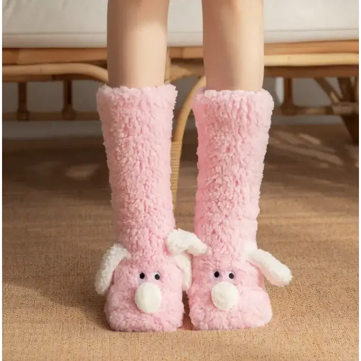 Pink fluffy bunny-themed knee-high socks with white ears and nose.
