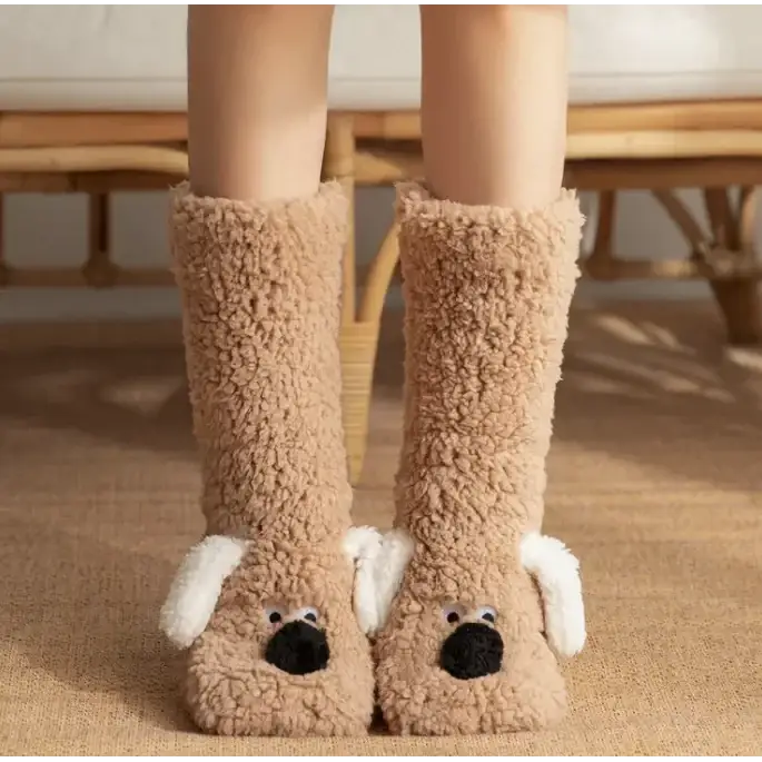 Tan, plush dog-shaped slippers with white floppy ears and black nose details.