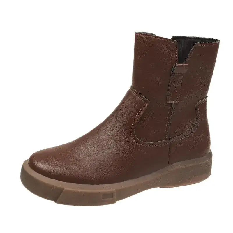 Brown leather ankle boot with a chunky sole and side zipper.