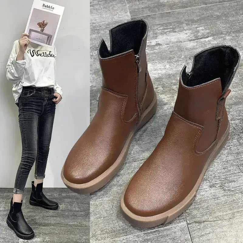 Brown leather ankle boots with a zipper on the inner side and a thick, light brown sole.