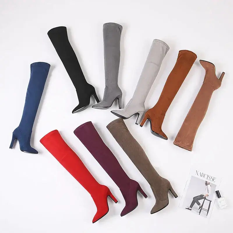 A collection of over-the-knee boots in various colors including black, gray, blue, red, and brown, made from a soft suede-like material with high heels.