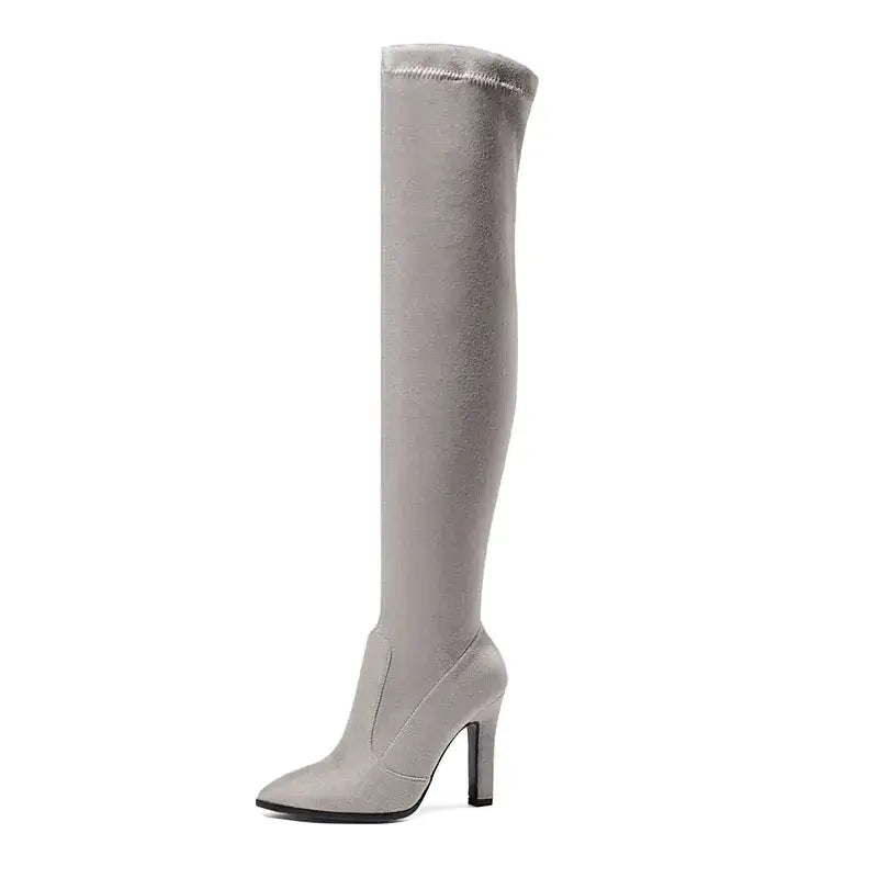 Gray over-the-knee boot with a sleek, stretchy fabric upper and a pointed toe.