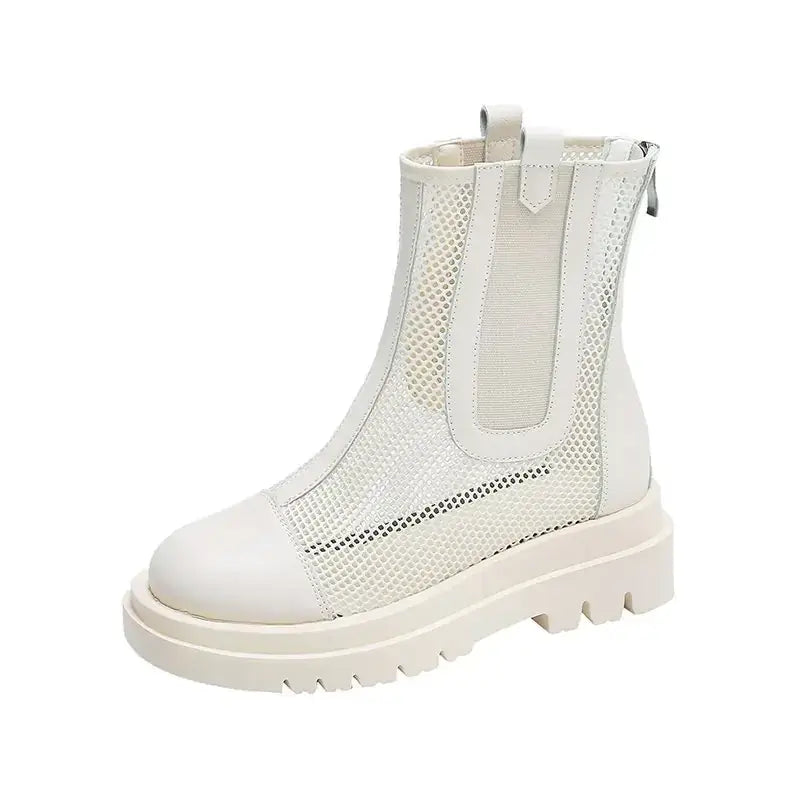 White mesh ankle boot with a chunky sole and elastic side panels.