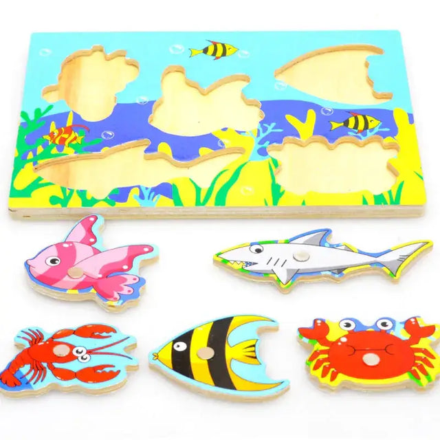 Colorful wooden ocean-themed puzzle board with matching fish, shark, lobster, and crab pieces.