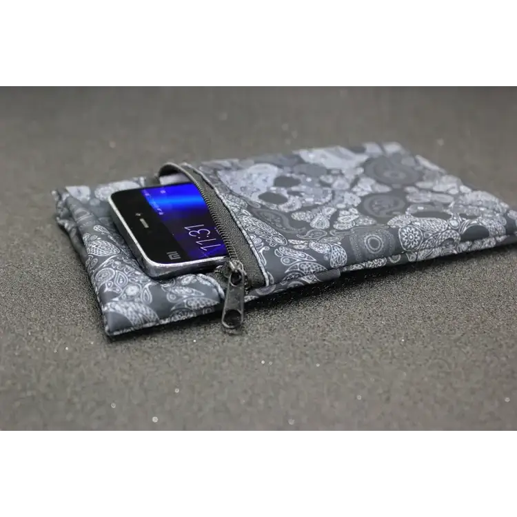 Gray and white skull-patterned phone pouch with a zipper closure.